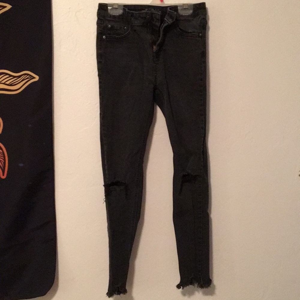 Black ripped jeans.
